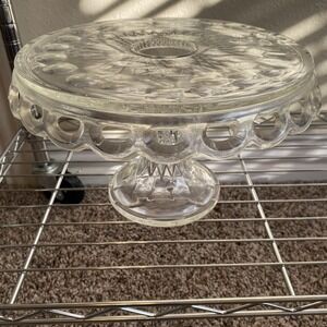 This item is a vintage McKee Plymouth clear pressed glass cake stand
